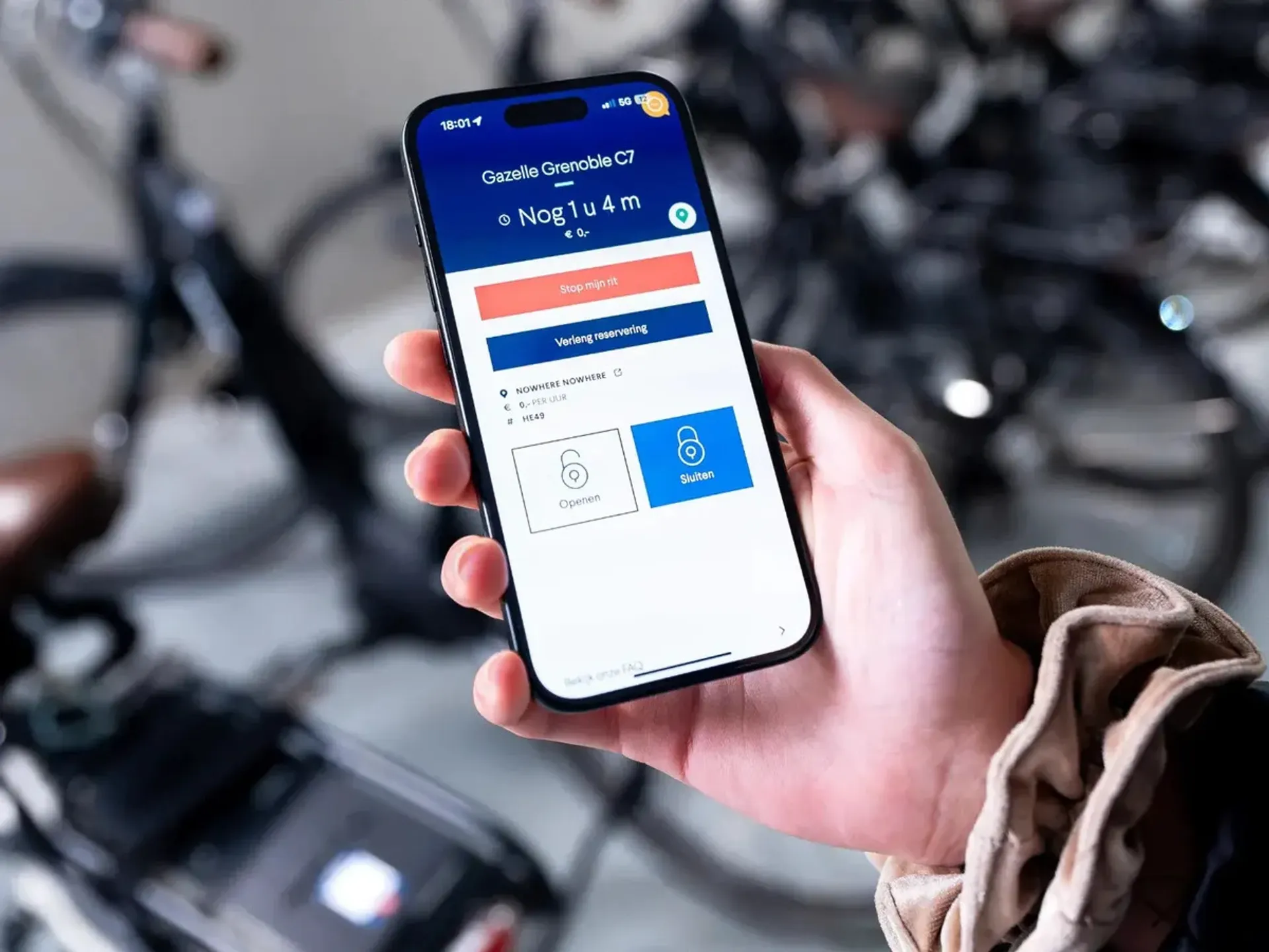 Een telefoonscherm, de reservering van een deelfiets staat open.